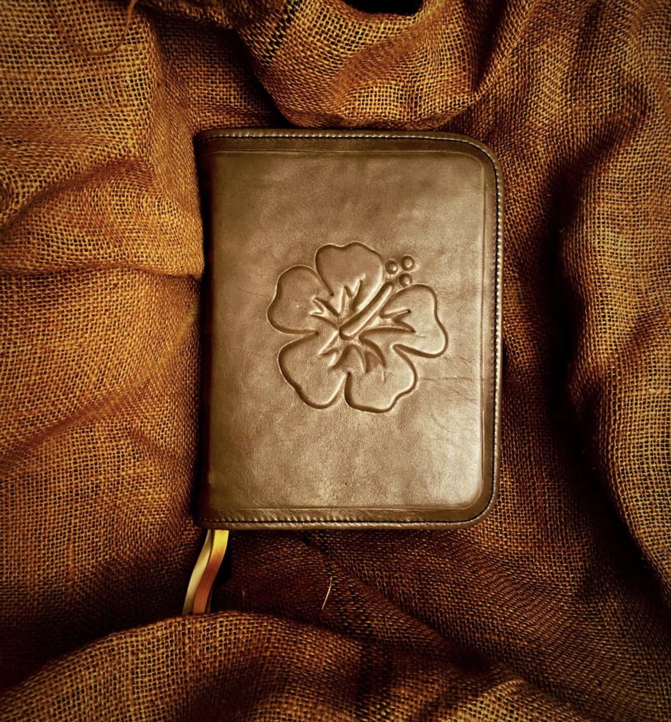 Brown leather Bible rebind with an embossed hibiscus flower