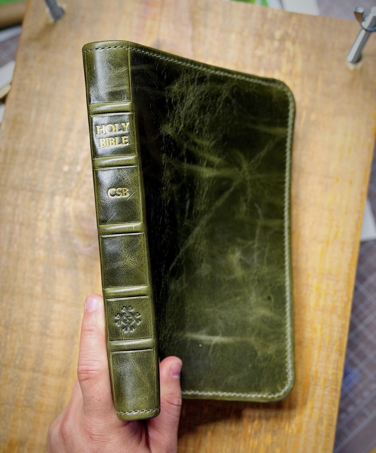 Distressed green leather Bible rebind with raised spine bands